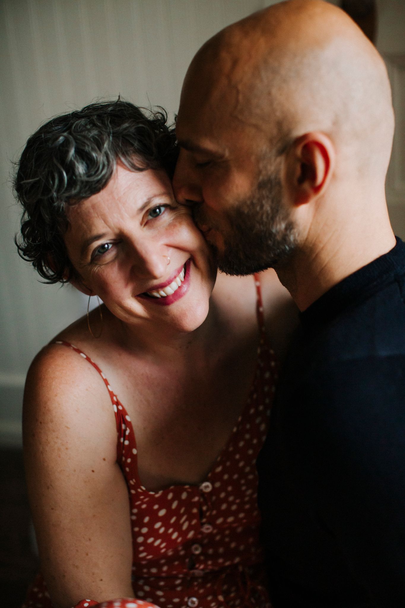 Ilya kissing Julia on the cheek
