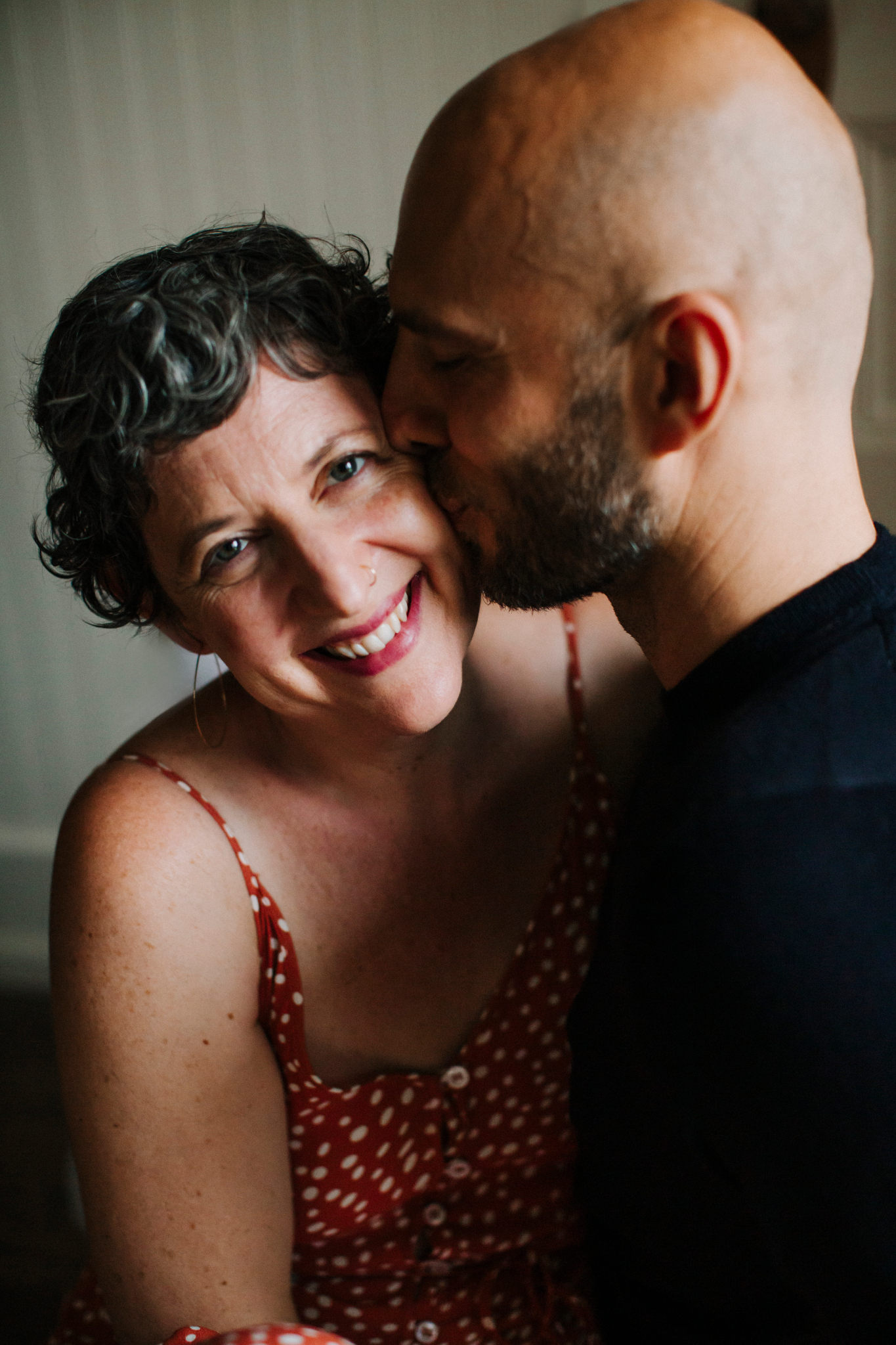 Ilya kissing Julia on the cheek