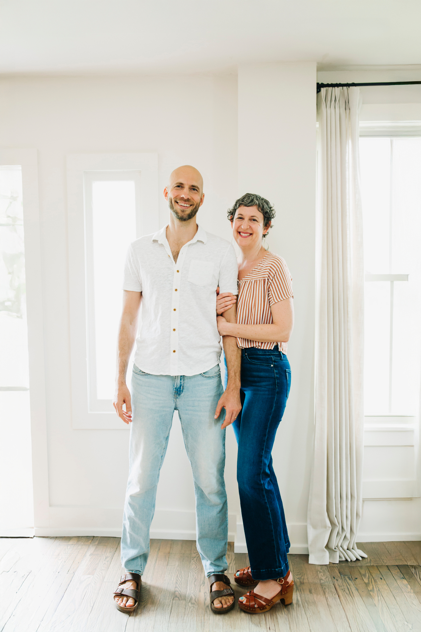 Julia and Ilya standing together at home